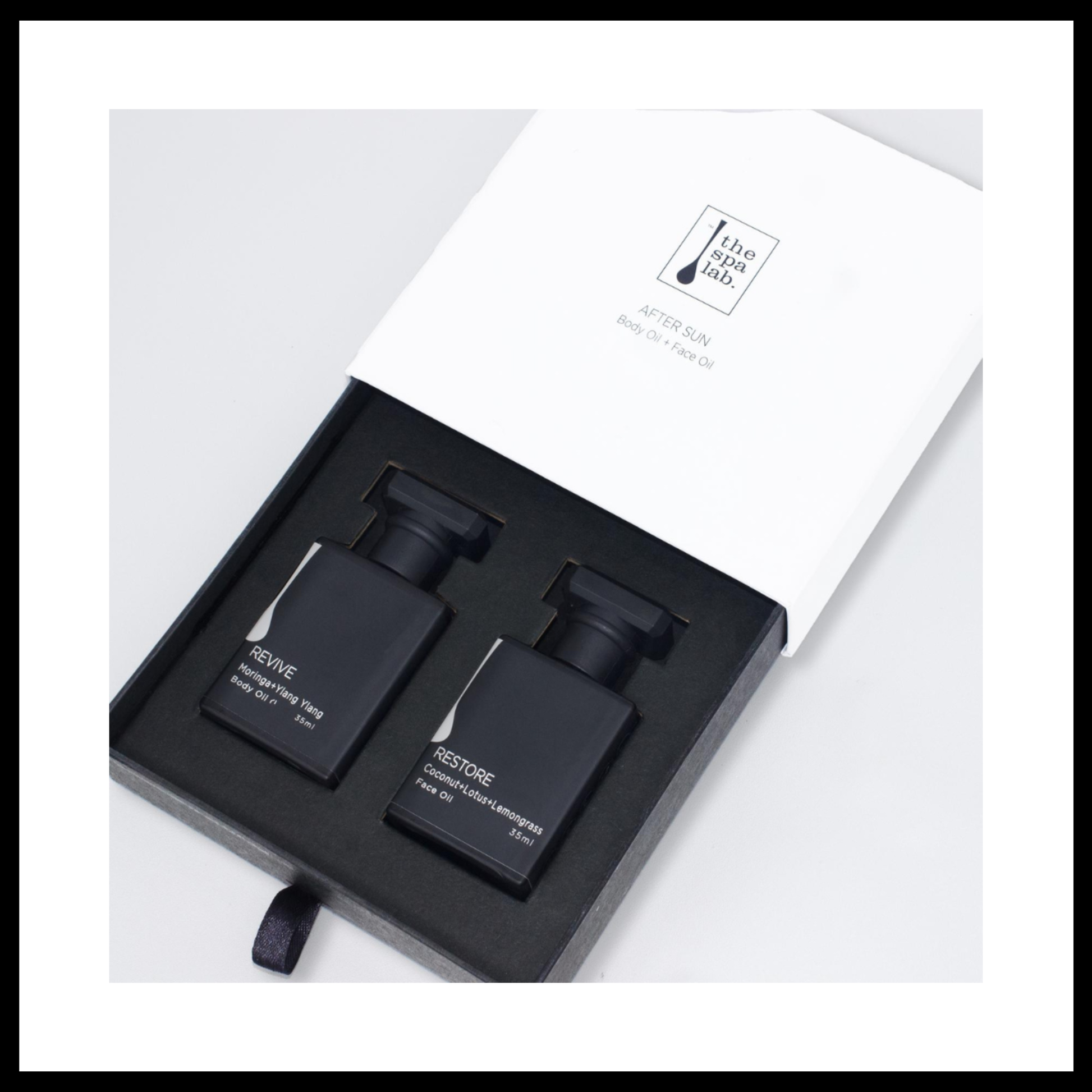 After sun products by THE SPA LAB of black bottles in white gift box
